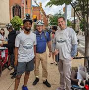 Baltimore Mayor Brandon Scott with Mayor's Bicycle Advisory Commission Chair Jon Laria and Baltimore Metropolitan Council Executive Director Mike Kelly.